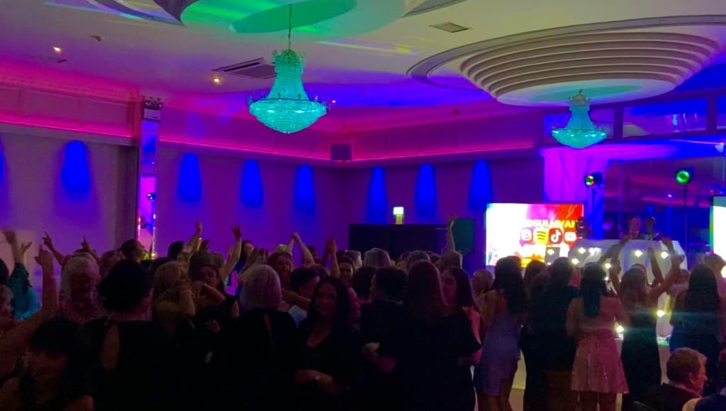 Cork event dancefloor with DJ branding and atmosphere