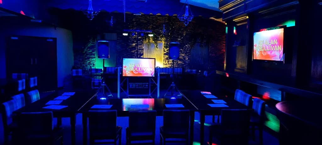 DJ Alan O'Sullivan setup with screens and equipment at Cork event
