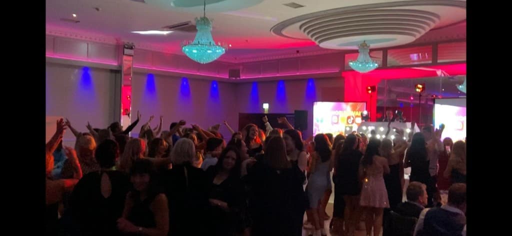 Full dancefloor at a Cork event with lighting and crowd