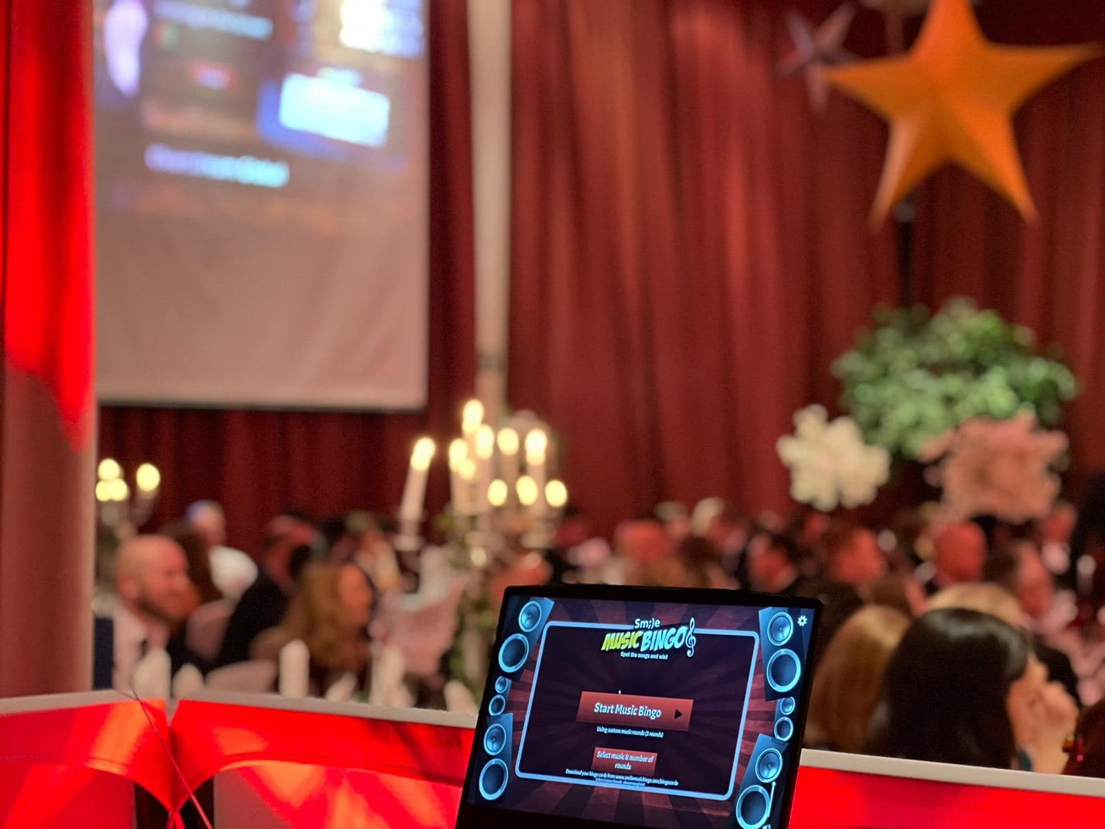 Music Bingo on screen at a corporate Christmas party