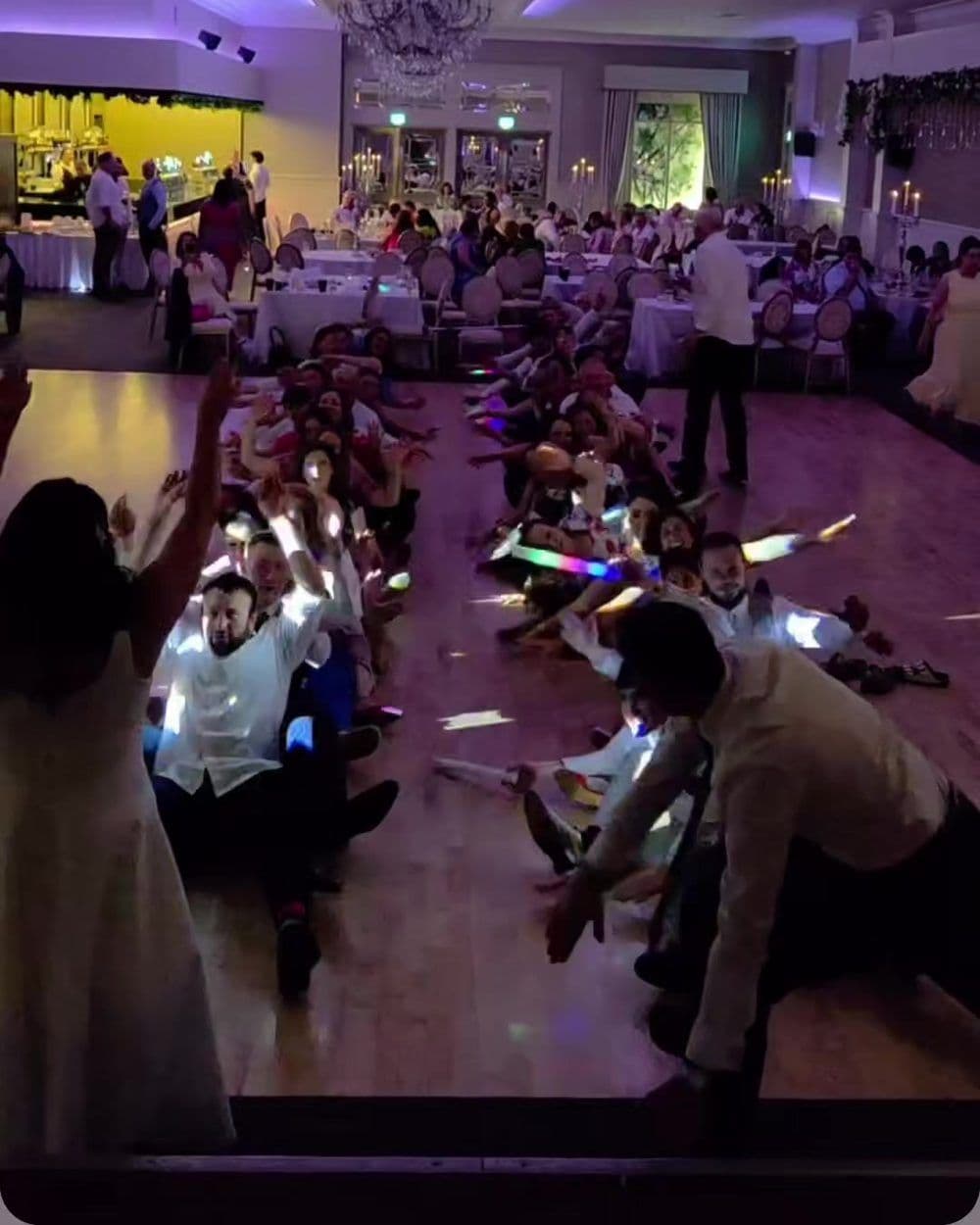 The bride and guests with glowsticks on a Cork wedding dancefloor